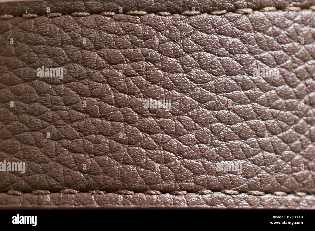 The texture of a brown leather watch strap. Close-up Stock Photo