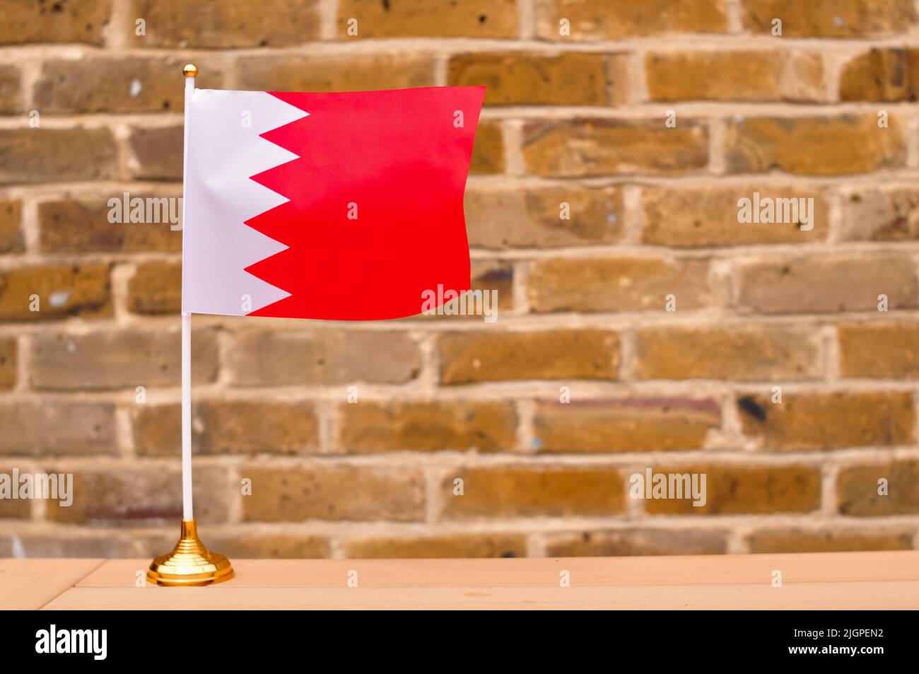 National colors of red and white on shirts hanging in store in Muharraq,  Bahrain, Middle East Stock Photo - Alamy