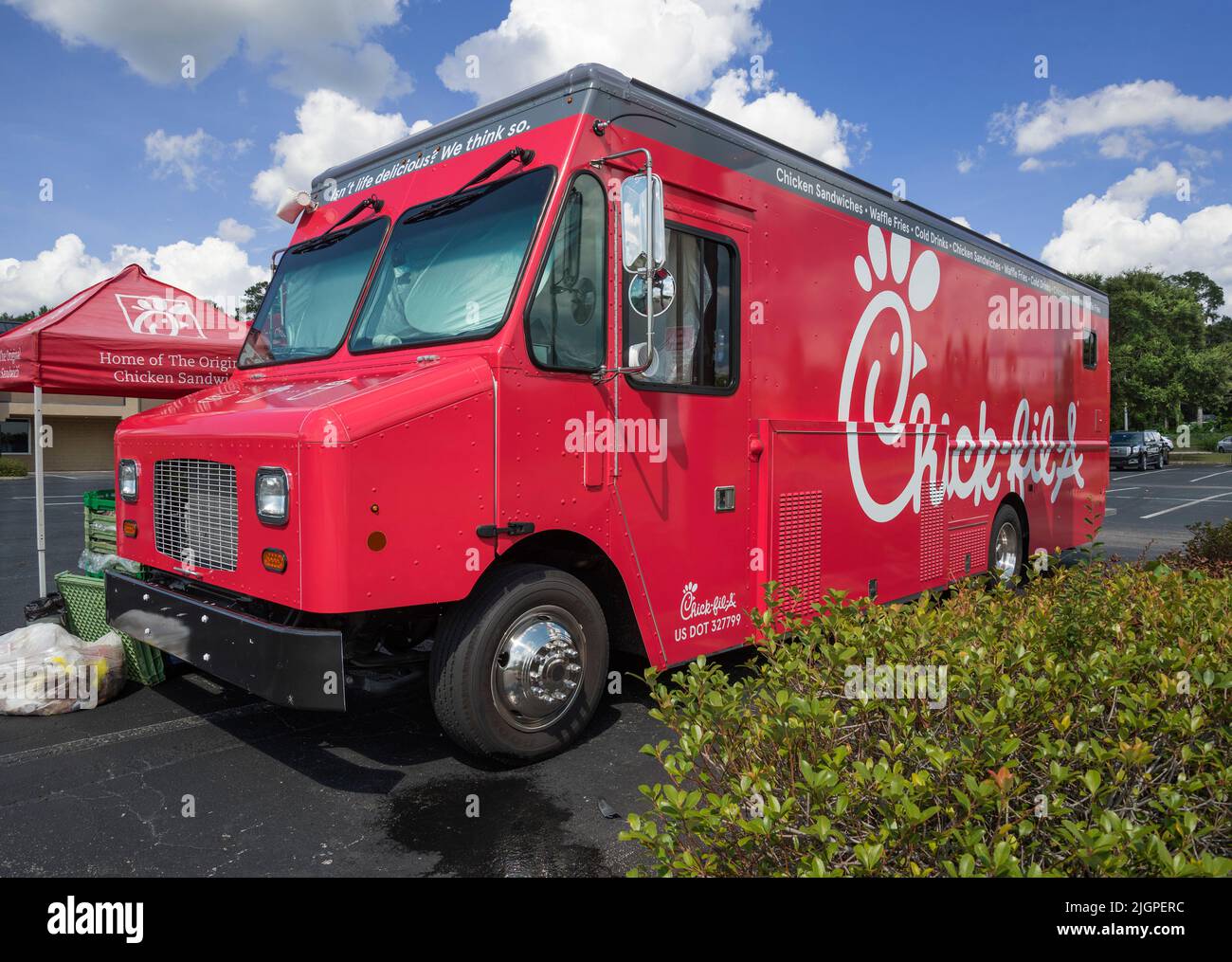 A mobile Chick-Fil-A, truck serves its goodies while parked in a shopping center parking lot in North Central Florida. Stock Photo