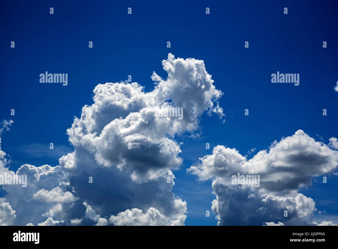Gorgeous blue sky populated with puffy white clouds on a beautiful summer day in North Central Florida. Stock Photo
