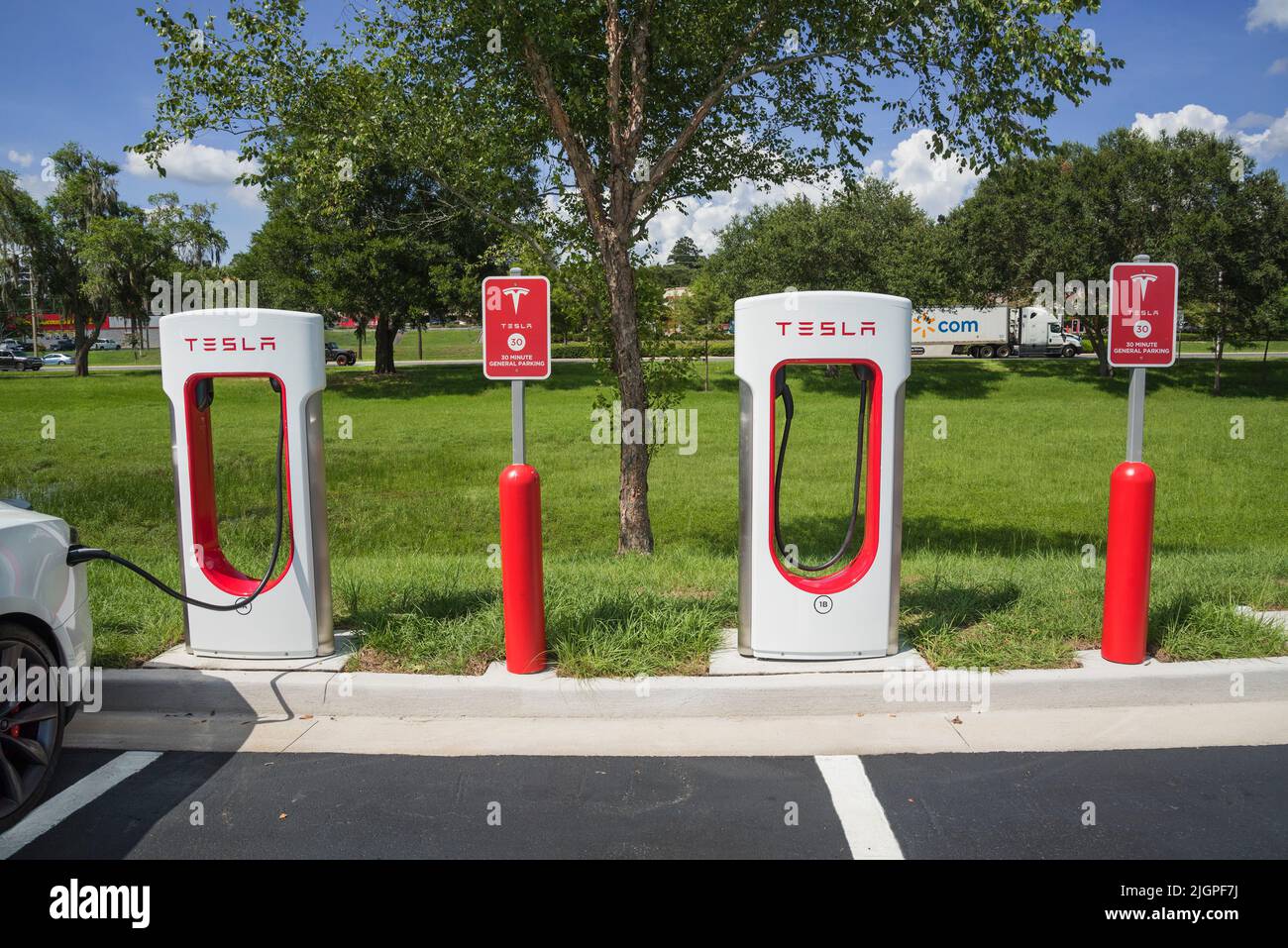 Electric car-vehicle charging station in the North Florida town of Alachua.  This is a small town located along Highway 441, near Gainesville. Stock Photo