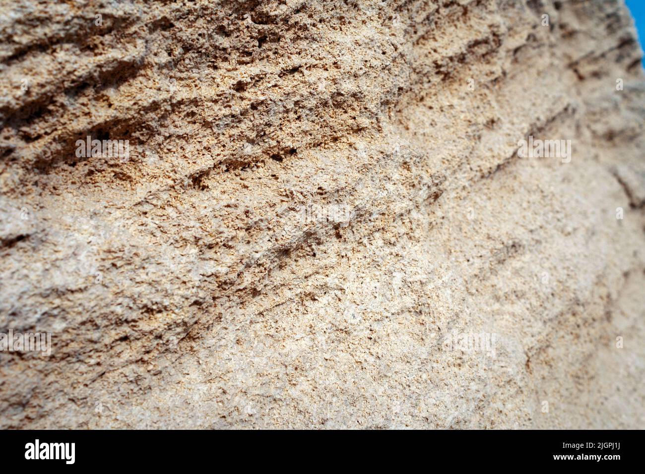 Surface sandy rock. Rocky shore of the Caspian Sea. Stock Photo