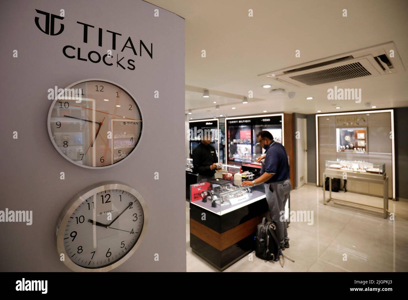 A customer checks wristwatches inside a Titan World showroom in Ahmedabad, India, July 12, 2022. REUTERS/Amit Dave Stock Photo