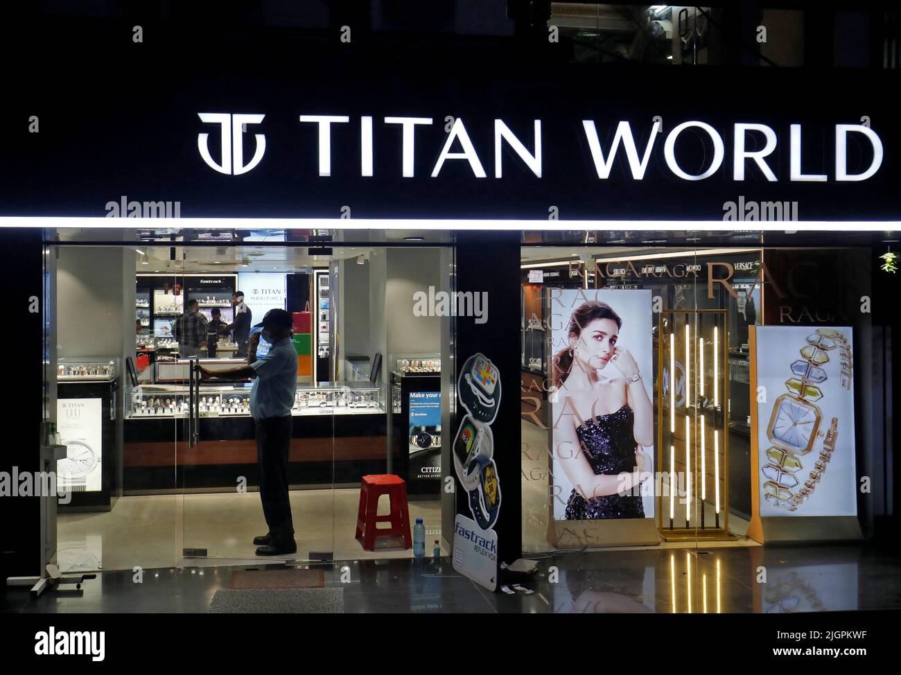 Customers stand inside a Titan World showroom in Ahmedabad, India, July 12, 2022. REUTERS/Amit Dave Stock Photo