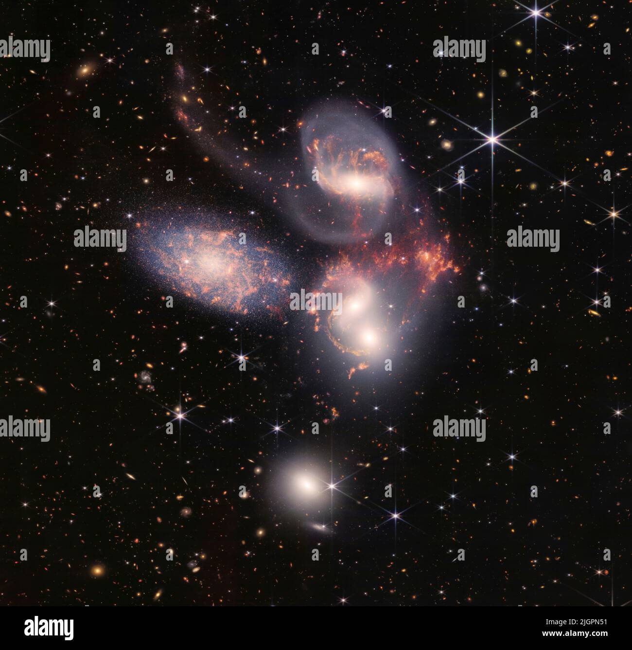 Today, NASAs James Webb Space Telescope reveals Stephans Quintet, a visual grouping of five galaxies, in a new light. This enormous mosaic is Webbs largest image to date, covering about one-fifth of the Moons diameter. It contains over 150 million pixels and is constructed from almost 1,000 separate image files. The information from Webb provides new insights into how galactic interactions may have driven galaxy evolution in the early universe. Mandatory Credit: NASA, ESA, CSA, and STScI via CNP Stock Photo