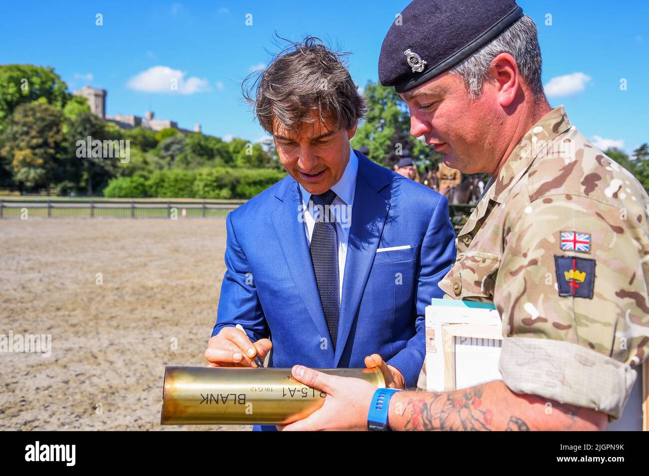 Windsor Castle, Windsor, Berkshire, UK. 8th July 2022. EMBARGOED UNTIL 12th JULY  Tom Cruise signing the cartridge shell which he fired from the 1st World War Gun that was used during the King's Troop Royal Horse Artillery display during the Platinum Jubilee Celebration back in May, which Tom introduced, on a private visit in the Private Grounds of Windsor Castle   Credit:Peter Nixon/Alamy Live News Stock Photo