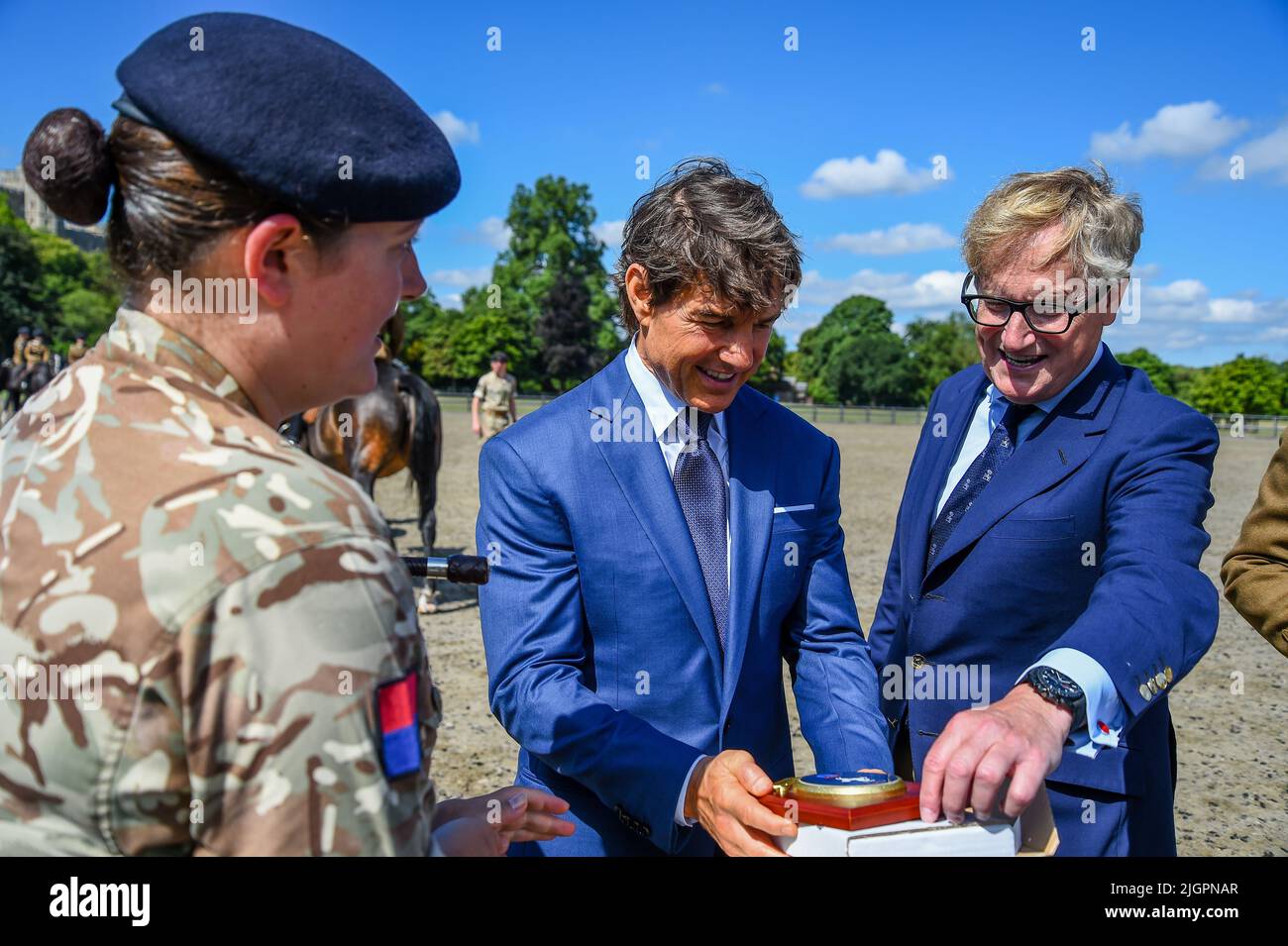Windsor Castle, Windsor, Berkshire, UK. 8th July 2022. EMBARGOED UNTIL 12th JULY  Tom Cruise receiving the regimental shield during a a private visit to meet members of the King's Troop Royal Horse Artillery, who he introduced during the Platinum Jubilee Celebration back in May, which Tom introduced, on a private visit in the Private Grounds of Windsor Castle   Credit:Peter Nixon/Alamy Live News Stock Photo