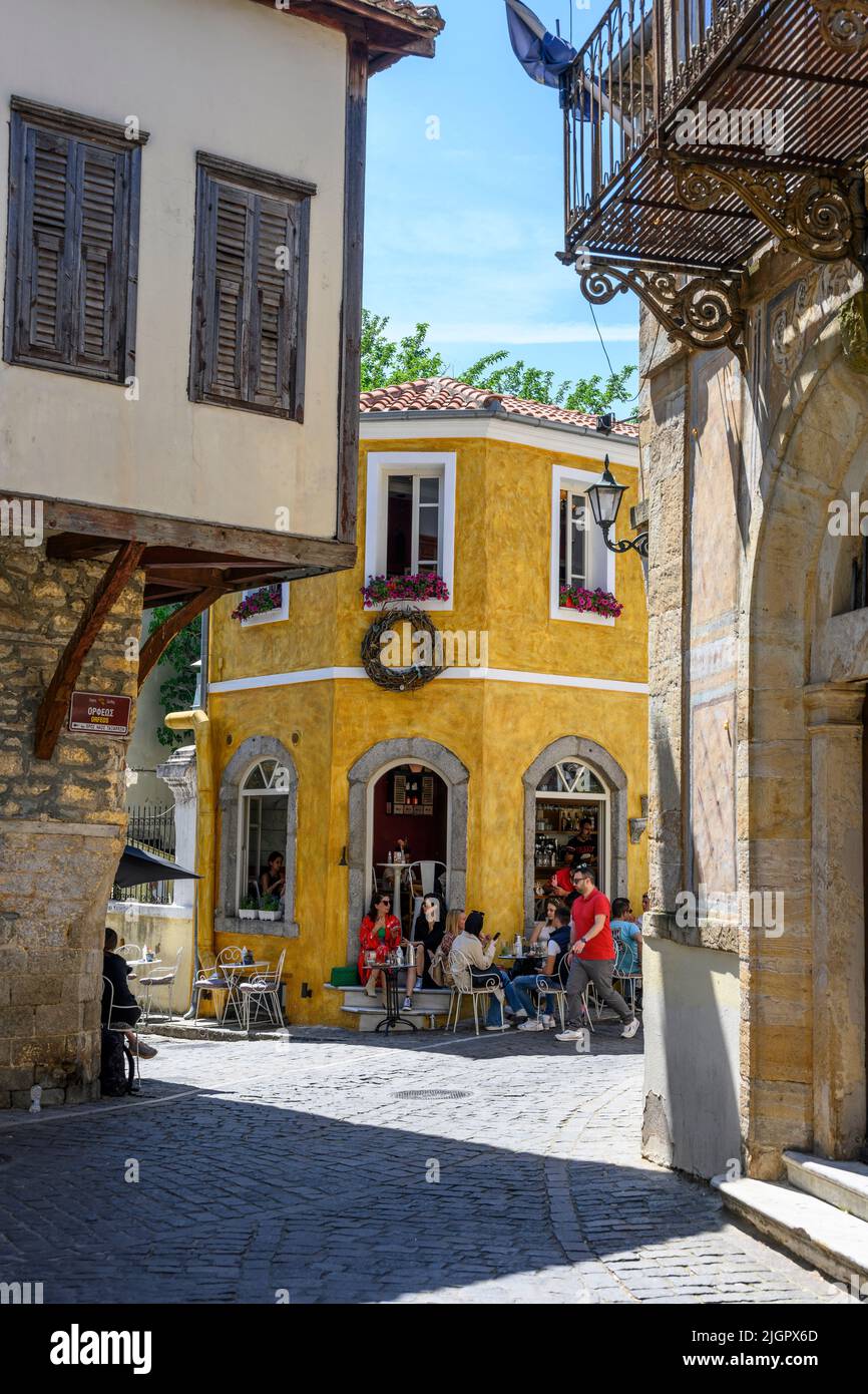Customers chatting at a coffee bar in the center of Xanthi's old town,  Xanthi, Western Thrace, Greece. Stock Photo