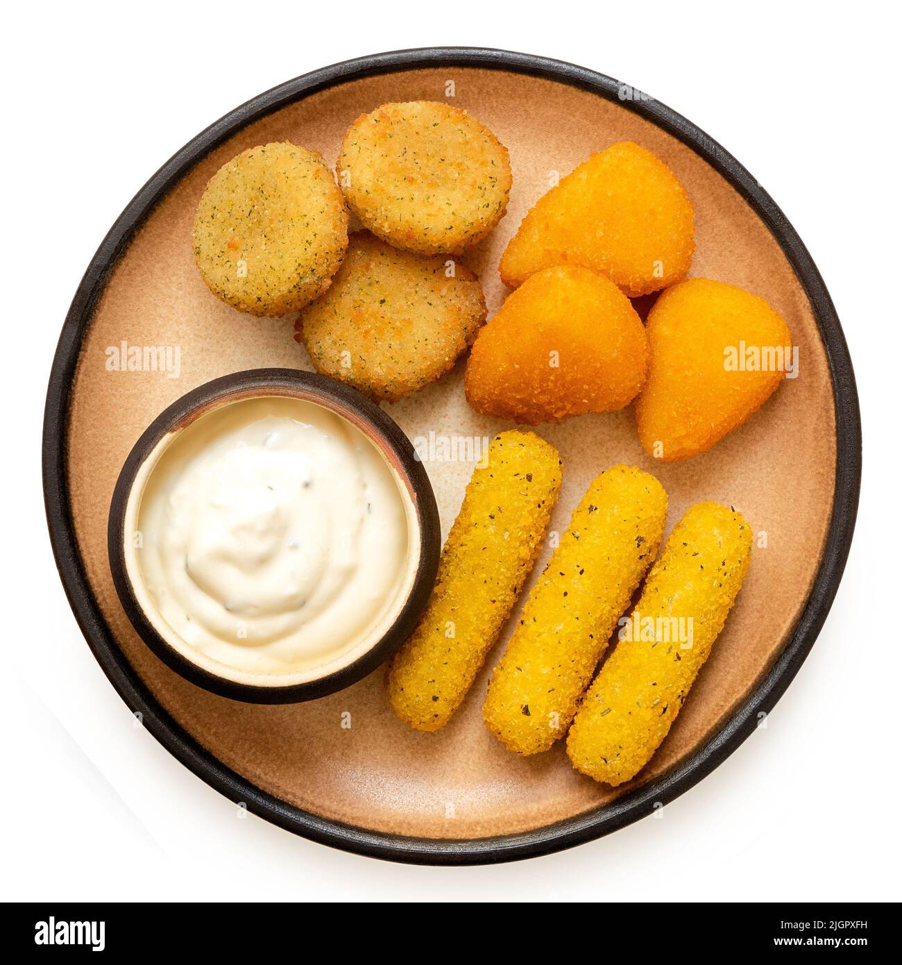 Fried breaded brie and camembert nuggets and mozzarella sticks on a rustic ceramic plate with white dip isolated on white. Top view. Stock Photo