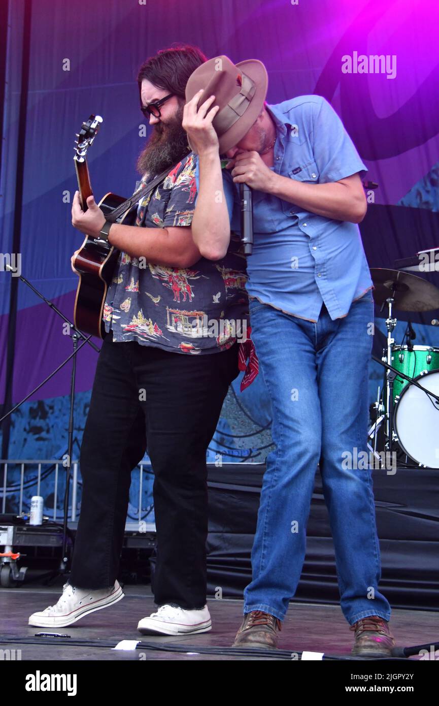 Old Crow Medicine Show band members are shown performing on stage