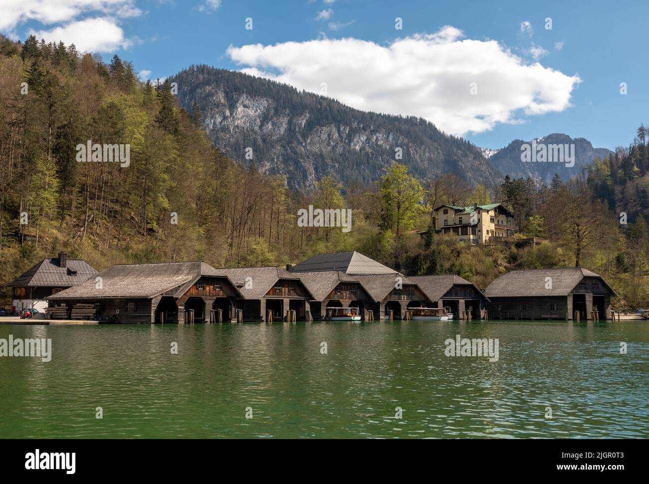 Boathouses in Schoenau at lake Koenigssee in Bavaria, Germany Stock Photo