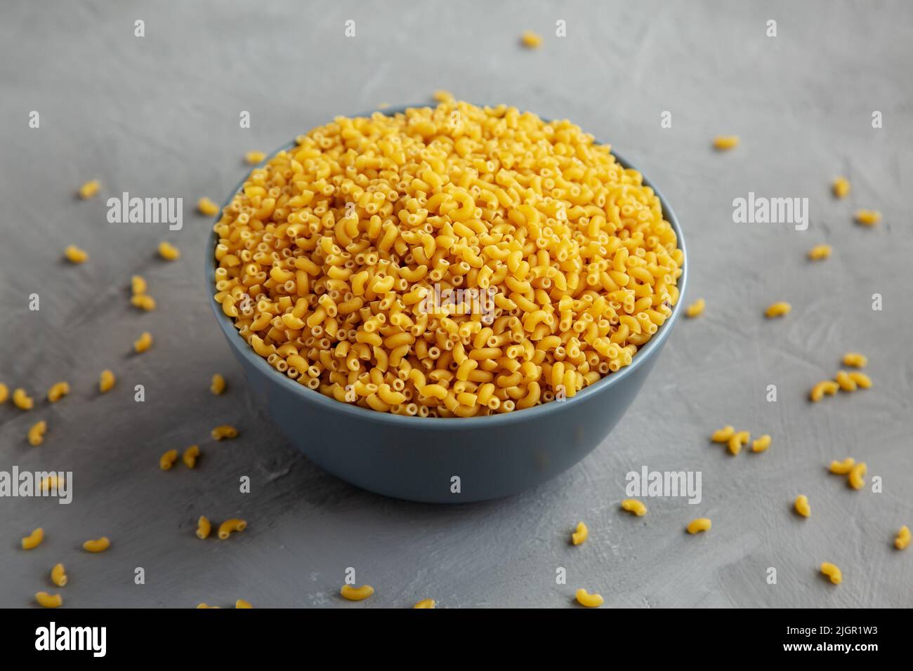 Dry Organic Pasta Coquillettes in a Bowl, side view Stock Photo - Alamy