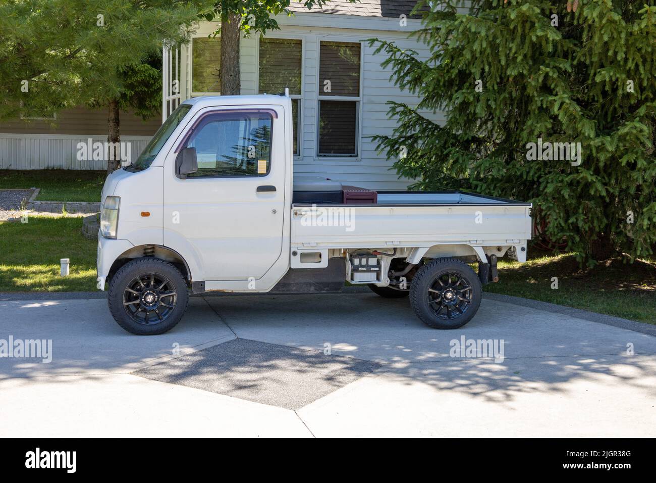 Japanese Carry Micro Suzuki Pick Up Truck Right Hand Drive, Parked In Ontario Canada Stock Photo