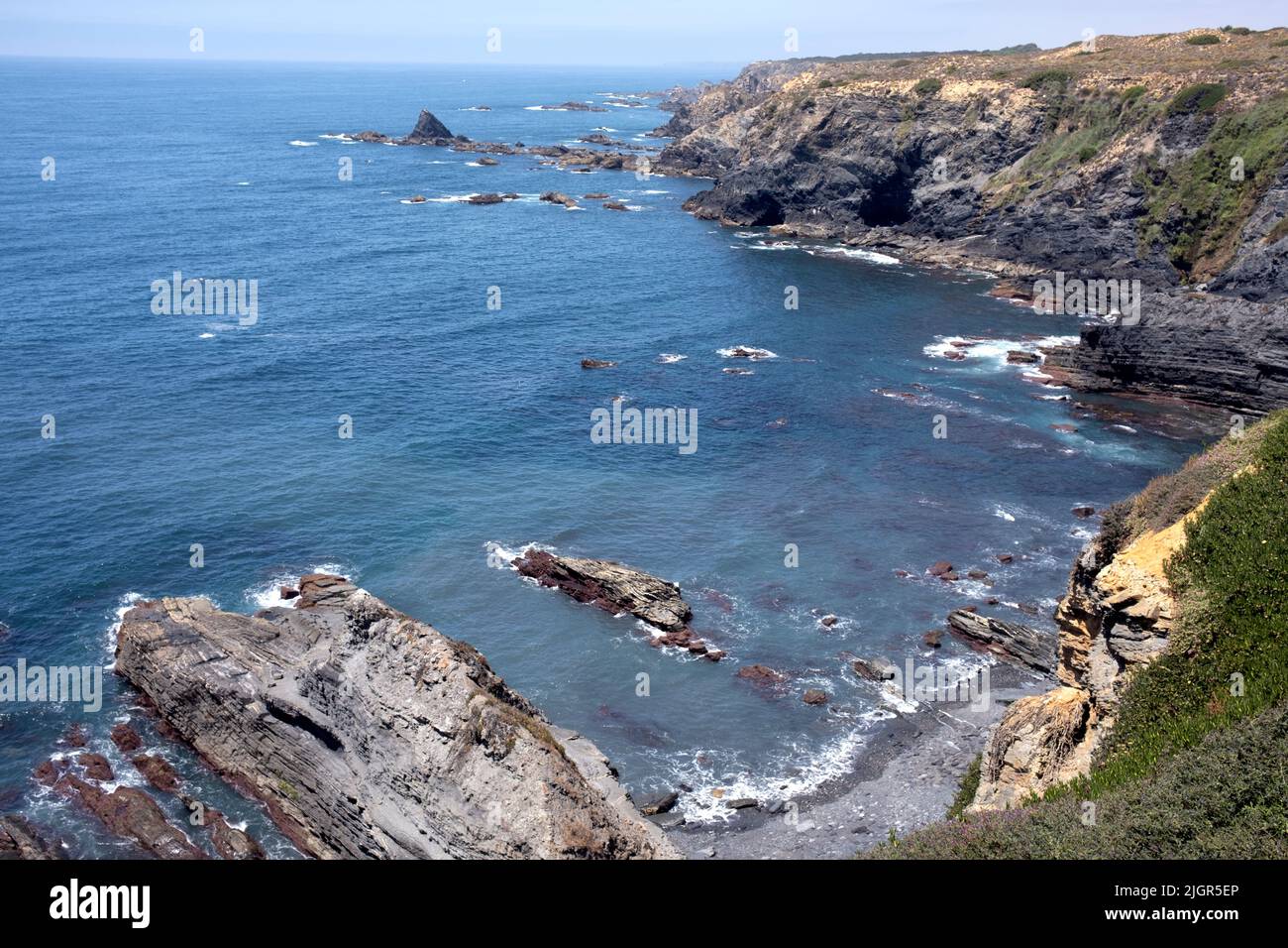 Sheer cliffs as seen from the top along Fishermens Path, Southwest Alentejo and Vicentine Coast Natural Park, Algarve, Portugal Stock Photo