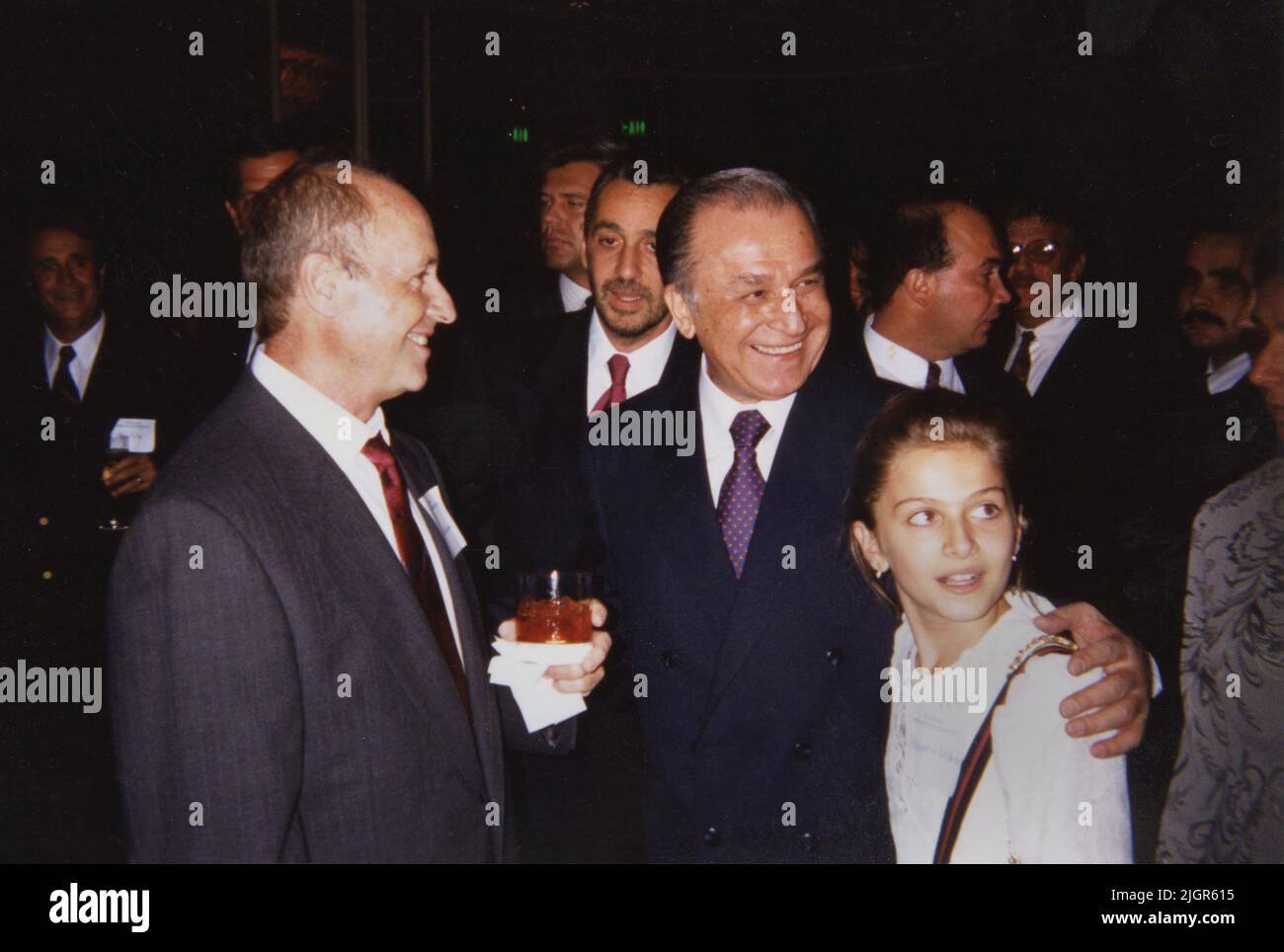 Los Angeles, CA, USA, approx. 1996.  Romanian president Ion Iliescu with young painter Alexandra Nechita. Behind him, Romanian politician Mihai Bujor (Sion). Stock Photo