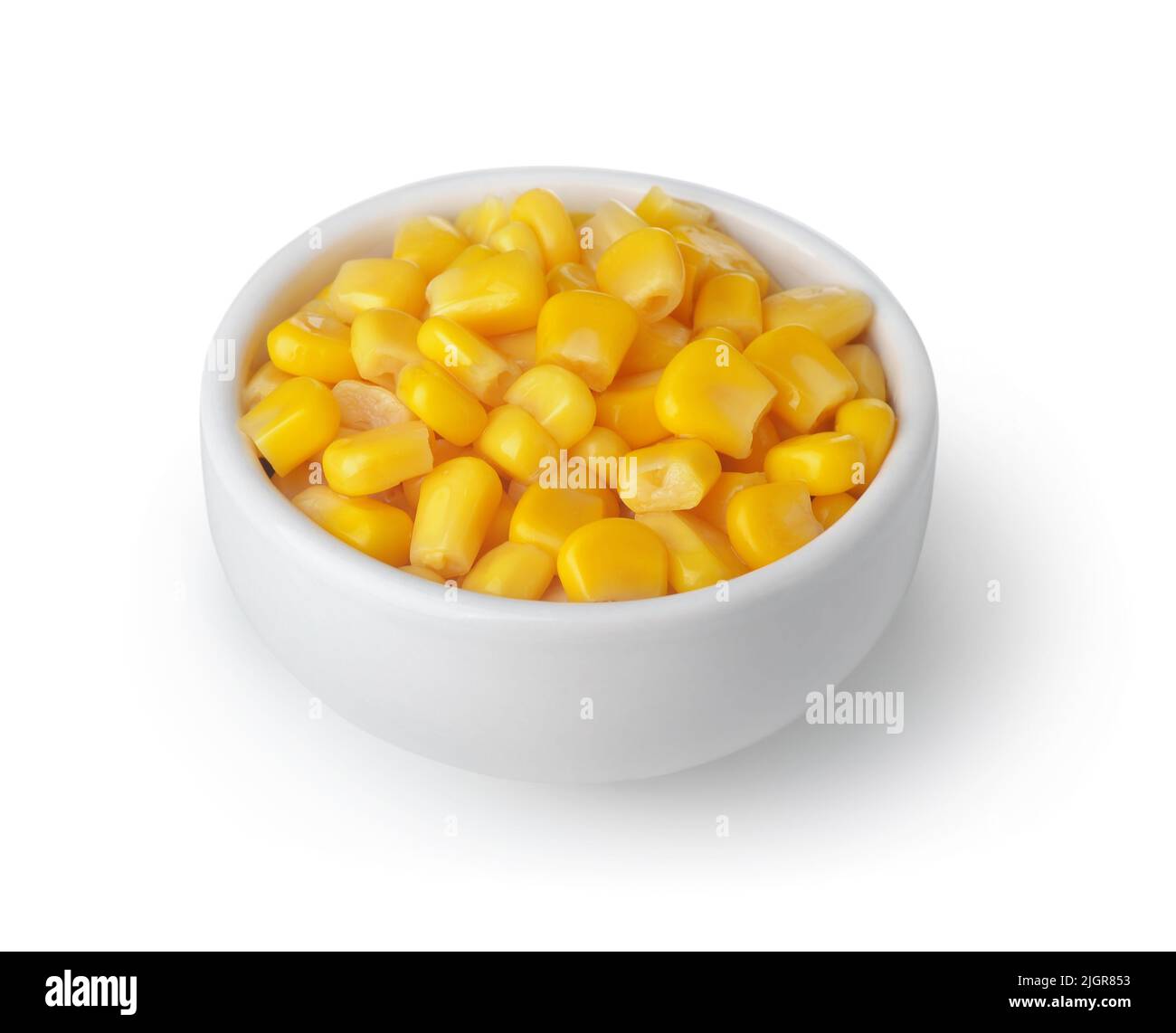 Canned sweet corn in small ceramic bowl isolated on white Stock Photo