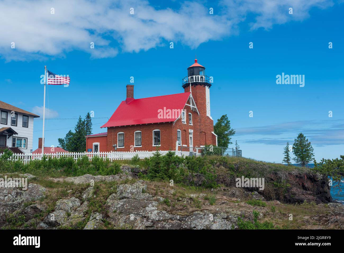 Eagle Harbor Lighthouse stands above a rocky entrance to Eagle Harbor