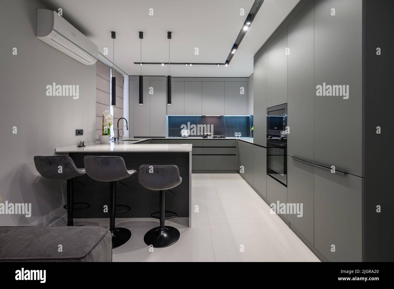 Picture of Luxury dining room and kitchen in studio apartment Stock Photo - Alamy