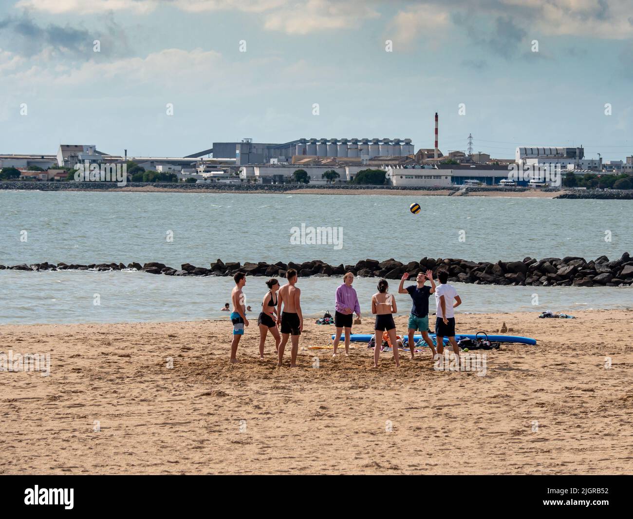 La Rochelle, France July 2022. Beach volleyball - a group of young people playing volleyball on the beach in La Rochelle, smiles on their faces, relax Stock Photo