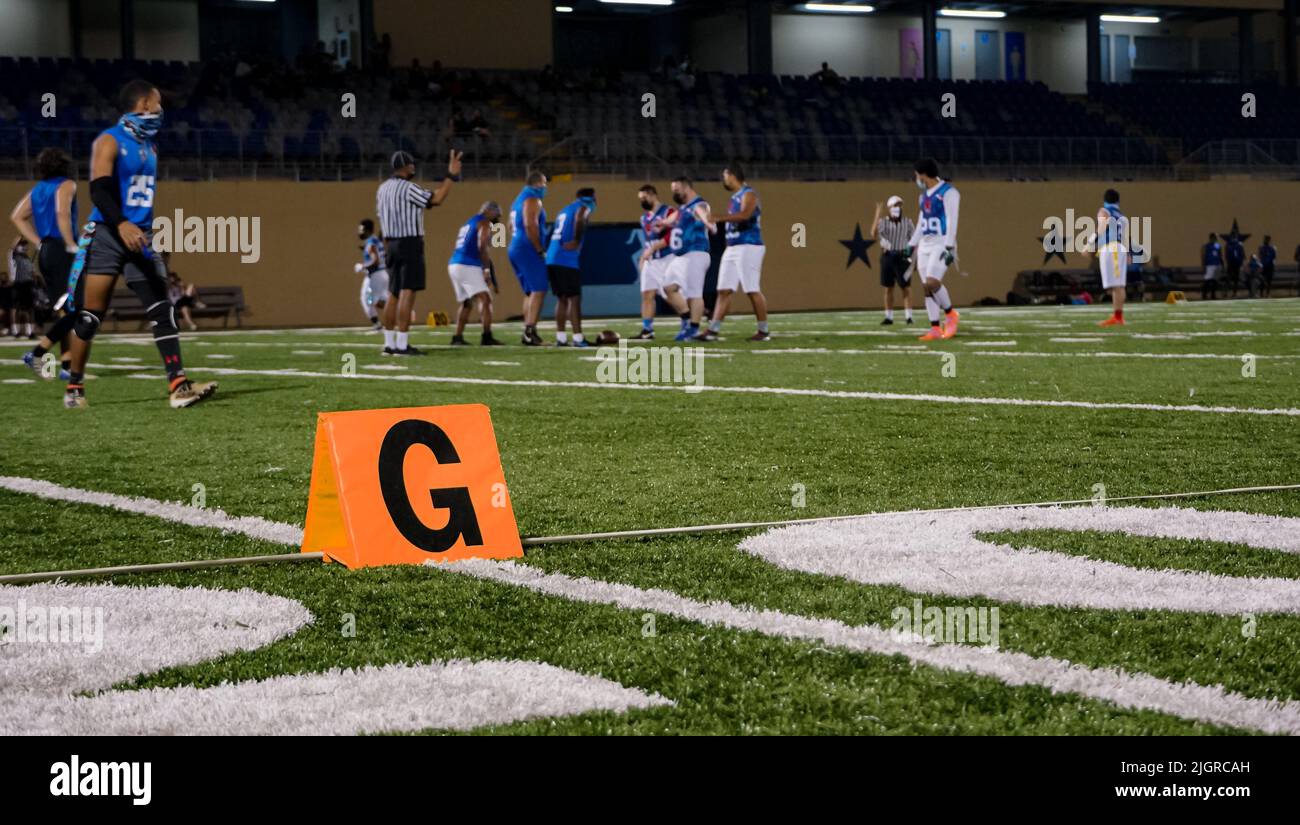 An American football gear in a field during a Flagfootball match at night Stock Photo Alamy