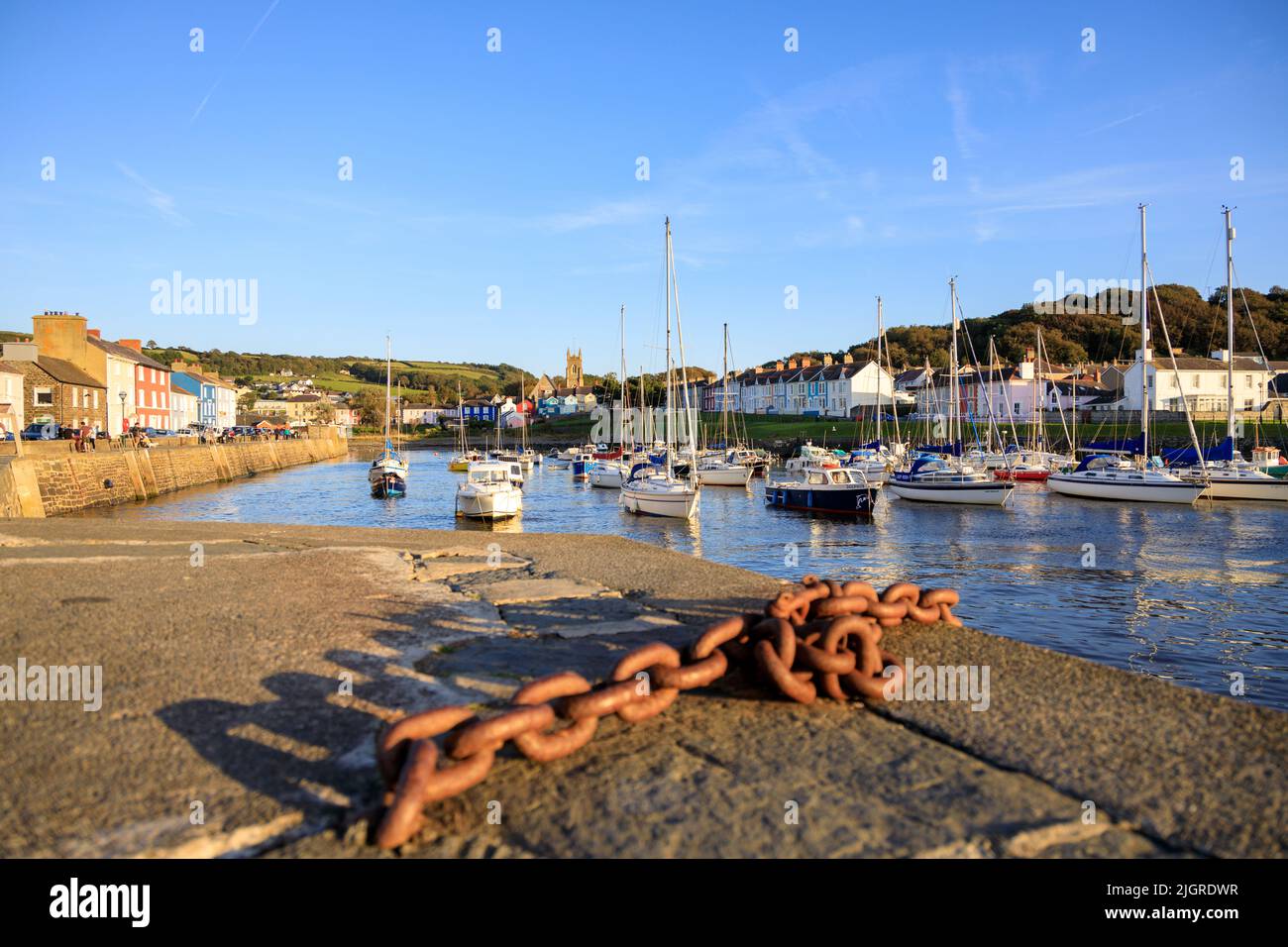 An evening view at Aberaeron Harbour, Wales, during a high tide with moored boats Stock Photo