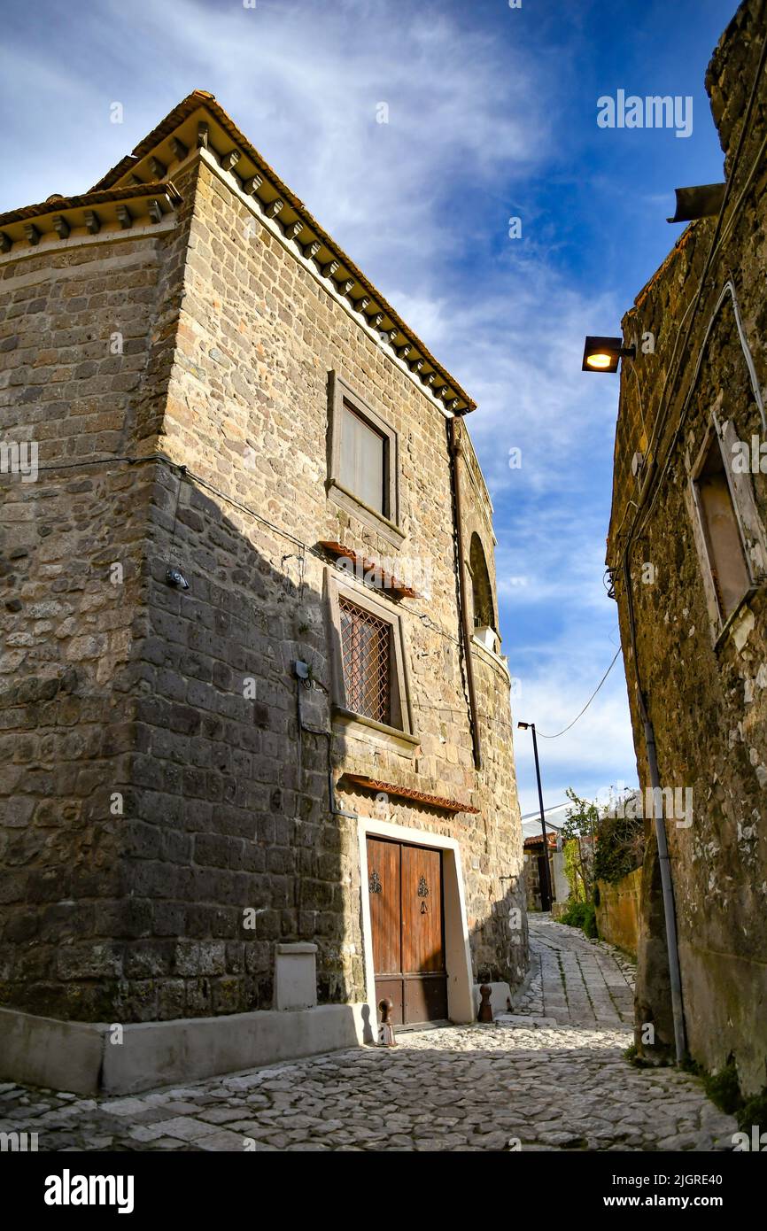 A narrow street among the old stone houses of the oldest district of the city of Caserta, Italy Stock Photo