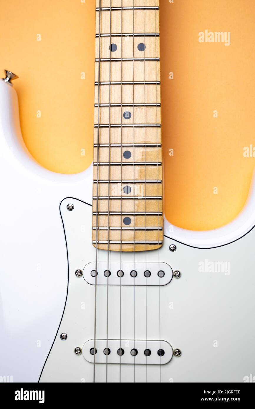 Photo of white Guitar. Electric Guitar with multiple pickups Stock