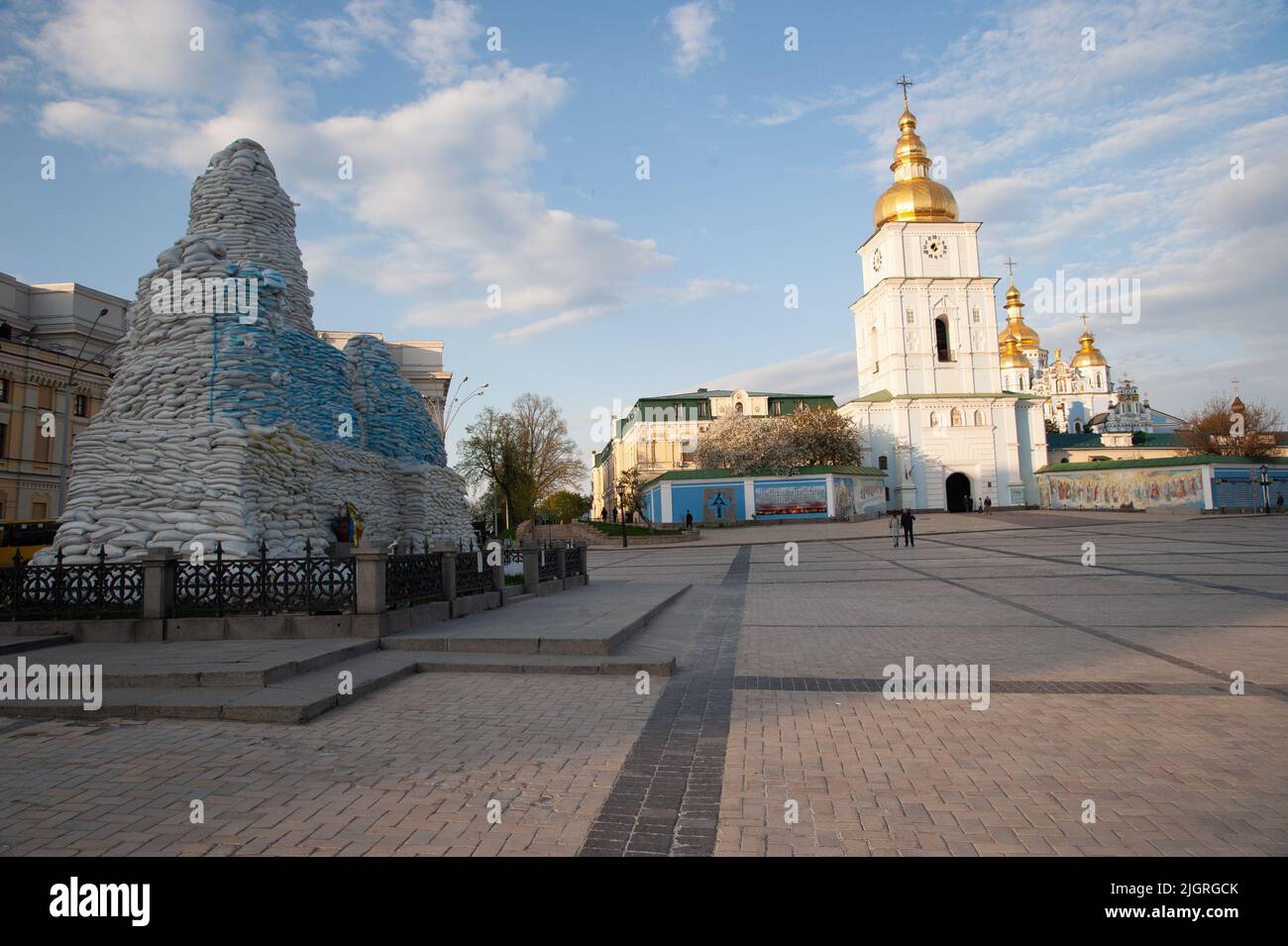 Square near St. Michael's Golden-Domed Monastery and monument to Princess Olha in Kyiv, Ukraine. Monument to Princess Olha is shielded with sandbags Stock Photo