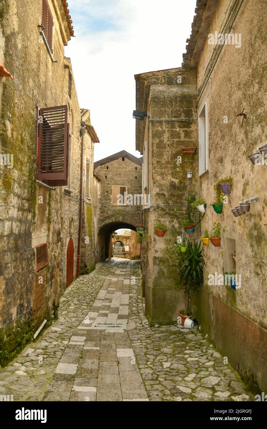 A narrow road among the old stone houses of the oldest district of the city of Caserta Stock Photo
