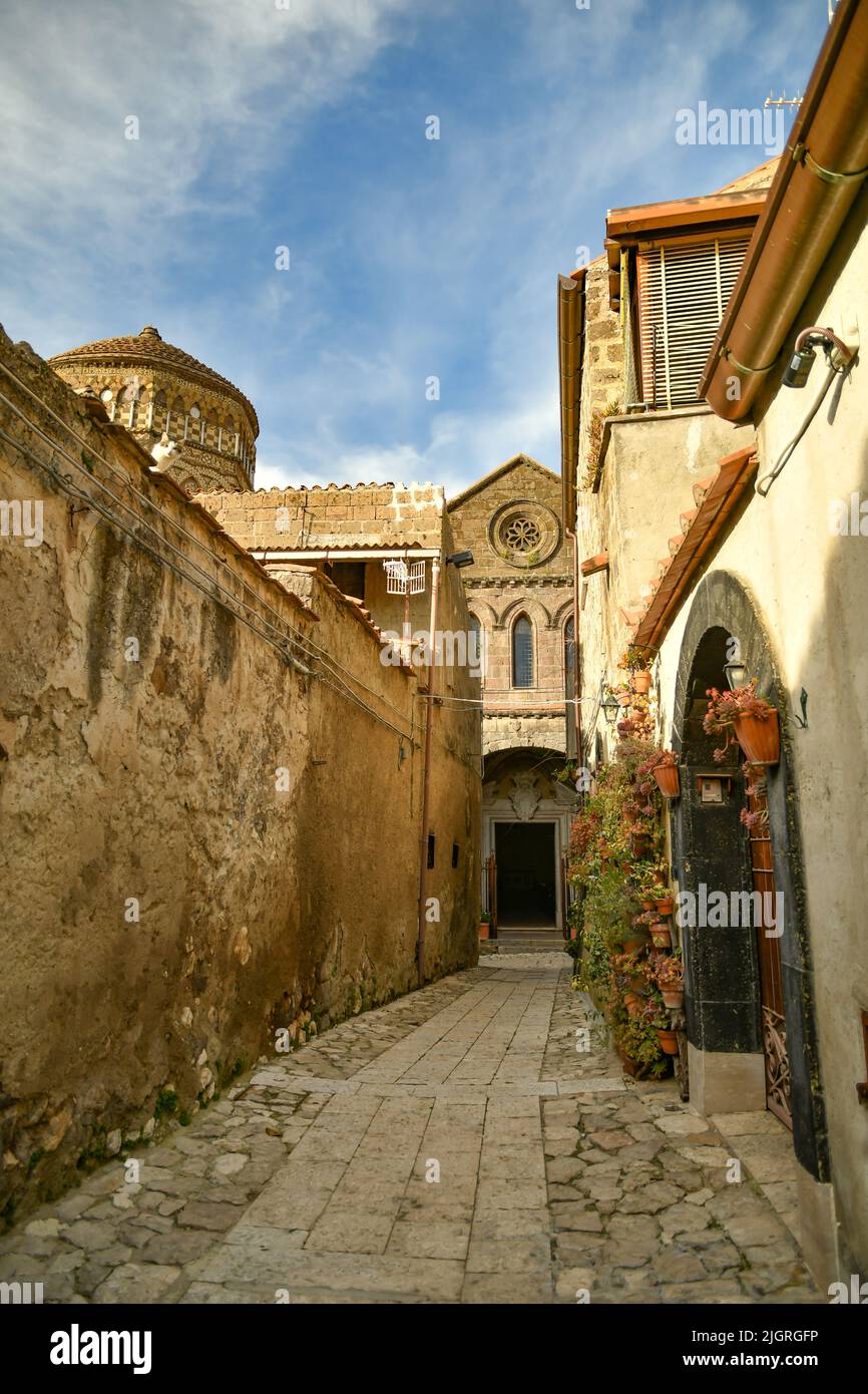 A narrow street among the old stone houses of the oldest district of the city of Caserta Stock Photo
