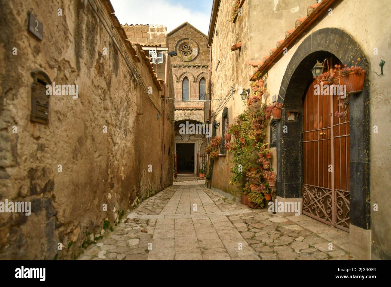 A walkway street among the old stone houses of the oldest district of the city of Caserta Stock Photo