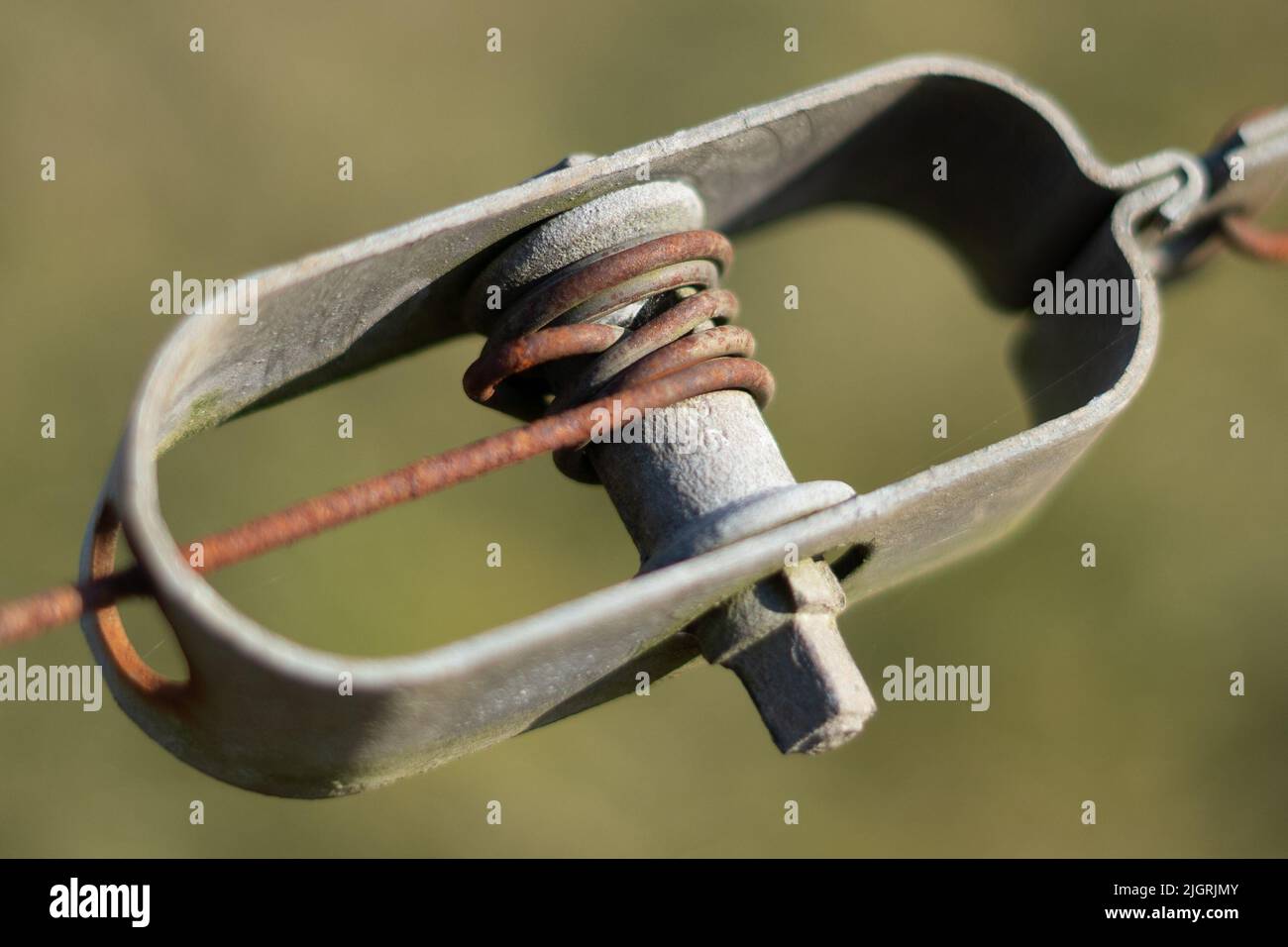 A closeup shot of barbed wire tensioner Stock Photo