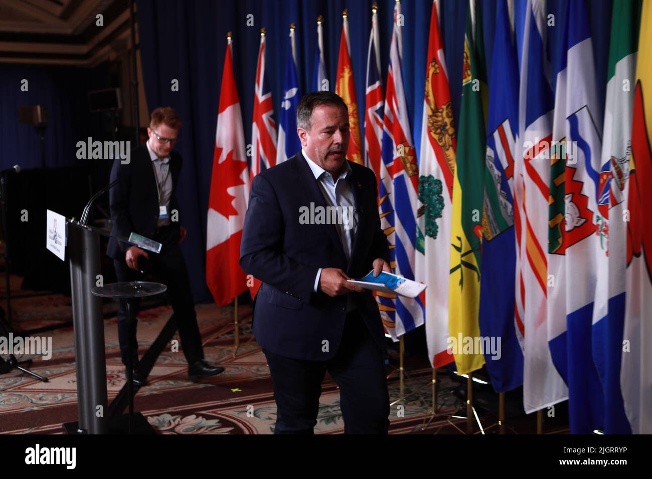 Alberta Premier Jason Kenney leaves the podium after questions during a