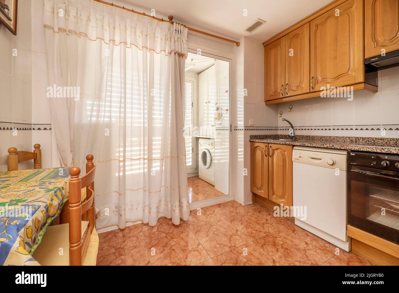 Kitchen with rustic wooden furniture, matching table and chairs
