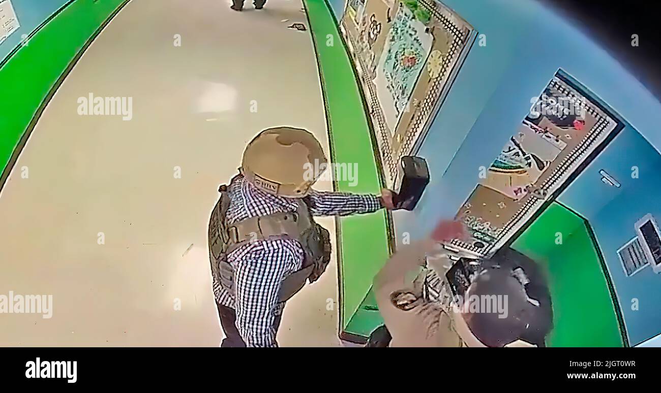 A Frame From A School Surveillance Video Shows A Responding Police a-frame-from-a-school-surveillance-video-shows-a-responding-police