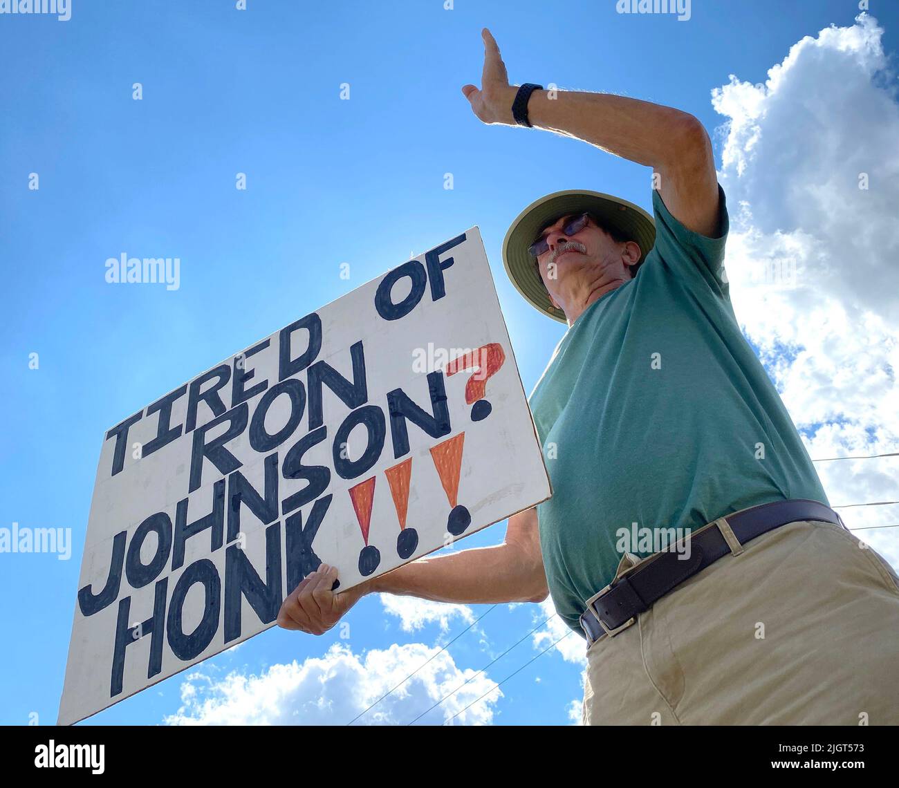 Racine, Wisconsin, USA. 12th July, 2022. Former Wisconsin State Senator JOHN LEHMAN is one of eleven people participating in their weekly protest against Sen. Ron Johnson (R-Wisconsin) at a busy intersection outside Racine, Wisconsin Tuesday July 12, 2022. They started the protests two months ago, and plan to continue until the November election. Johnson's Democratic opponent will be determined in an August primary election. The protesters also had signs about gun control and abortion rights. They had previously protested weekly in downtown Racine for the length of Donald J. Trump's presiden Stock Photo