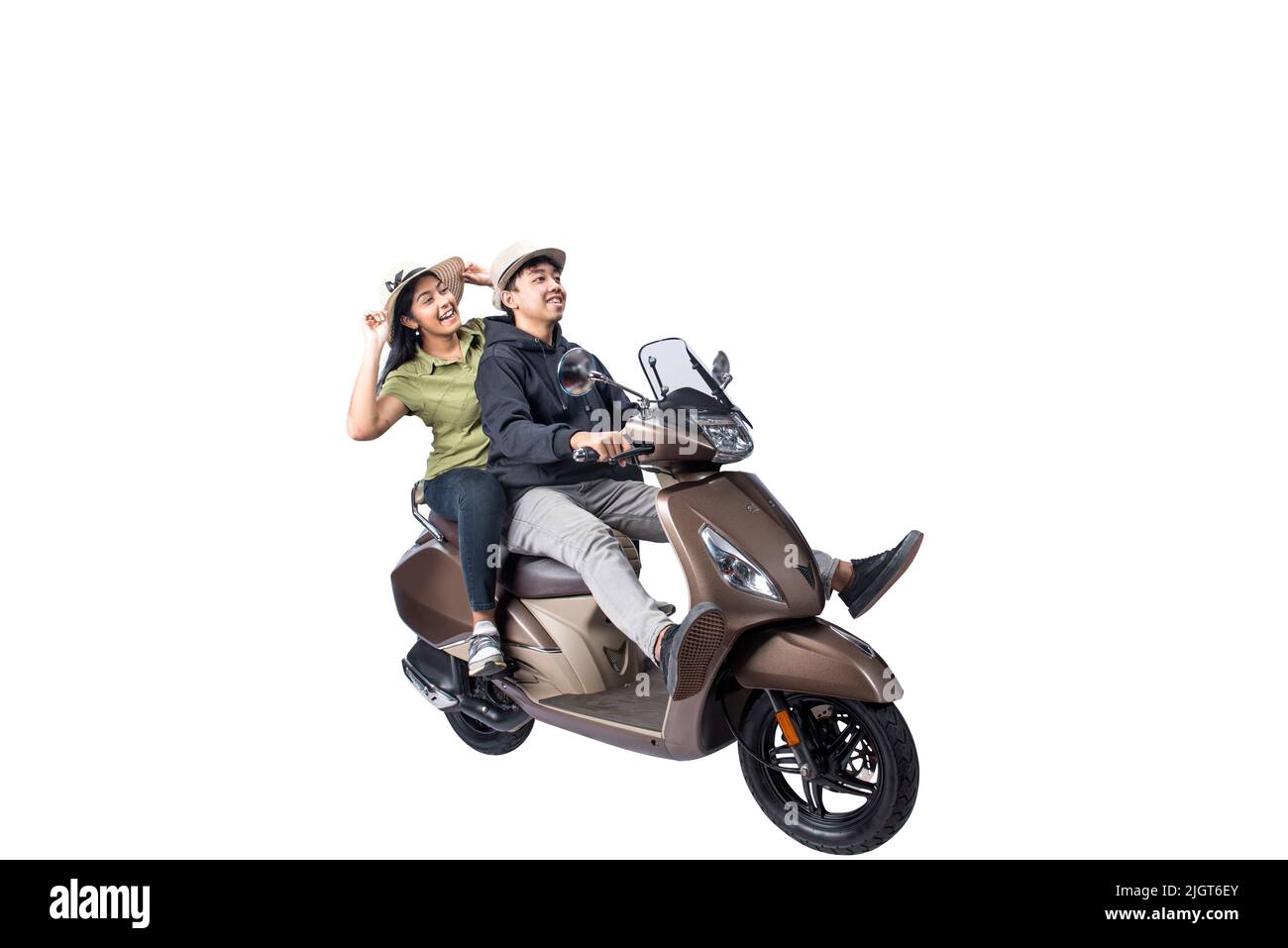 Asian couple with a hat sitting on a scooter isolated over white background Stock Photo