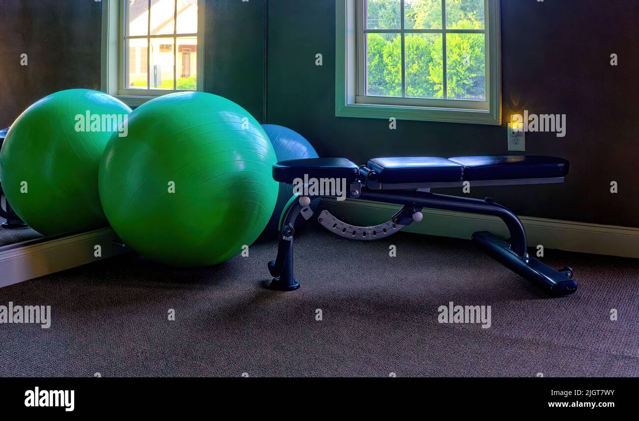 Exercise Balls and Weight Lifting Bench in Gym Stock Photo Alamy
