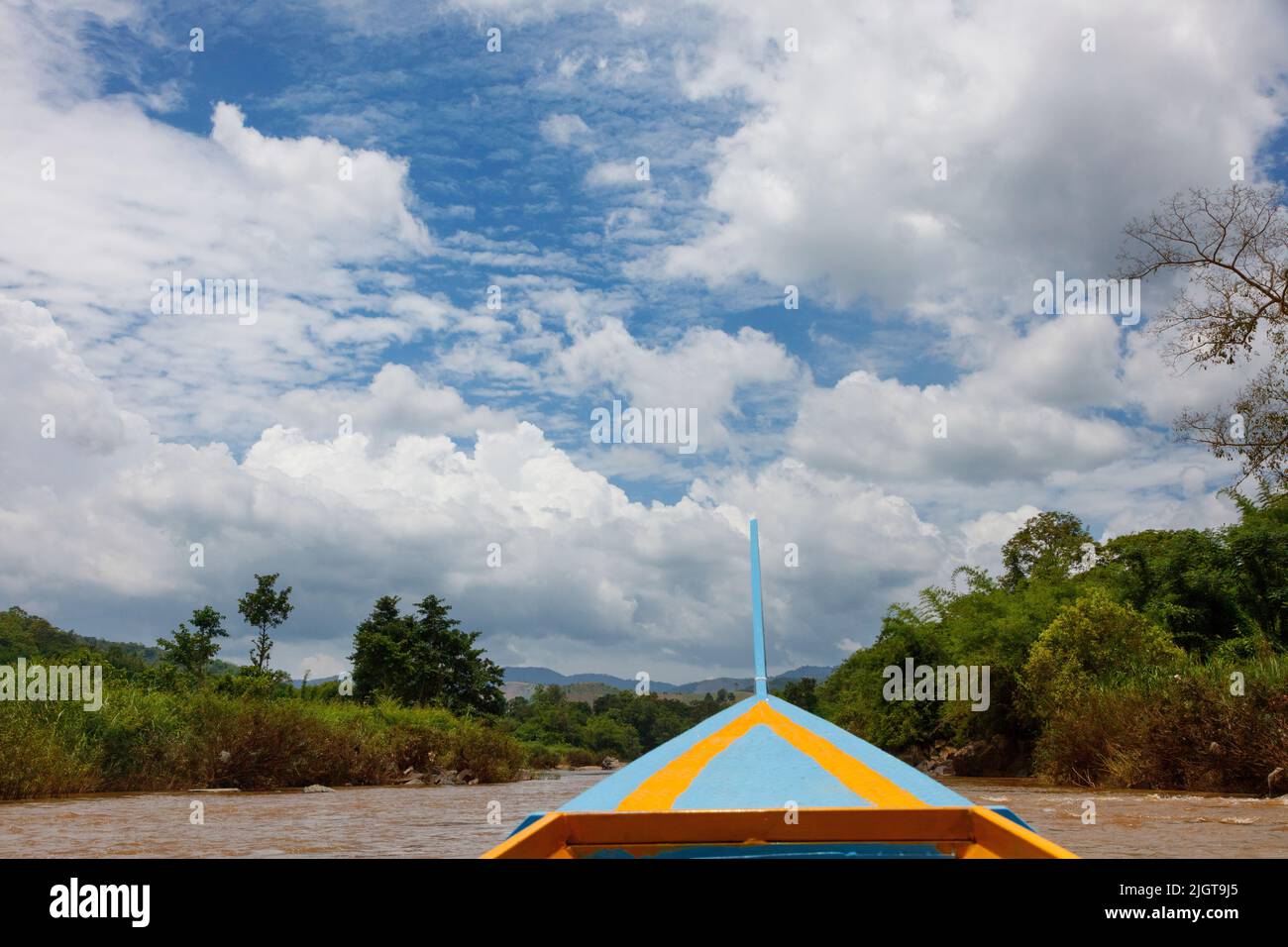 A boat trip along the MAE KOK river from Thaton to Chiang Rai  - THAILAND Stock Photo