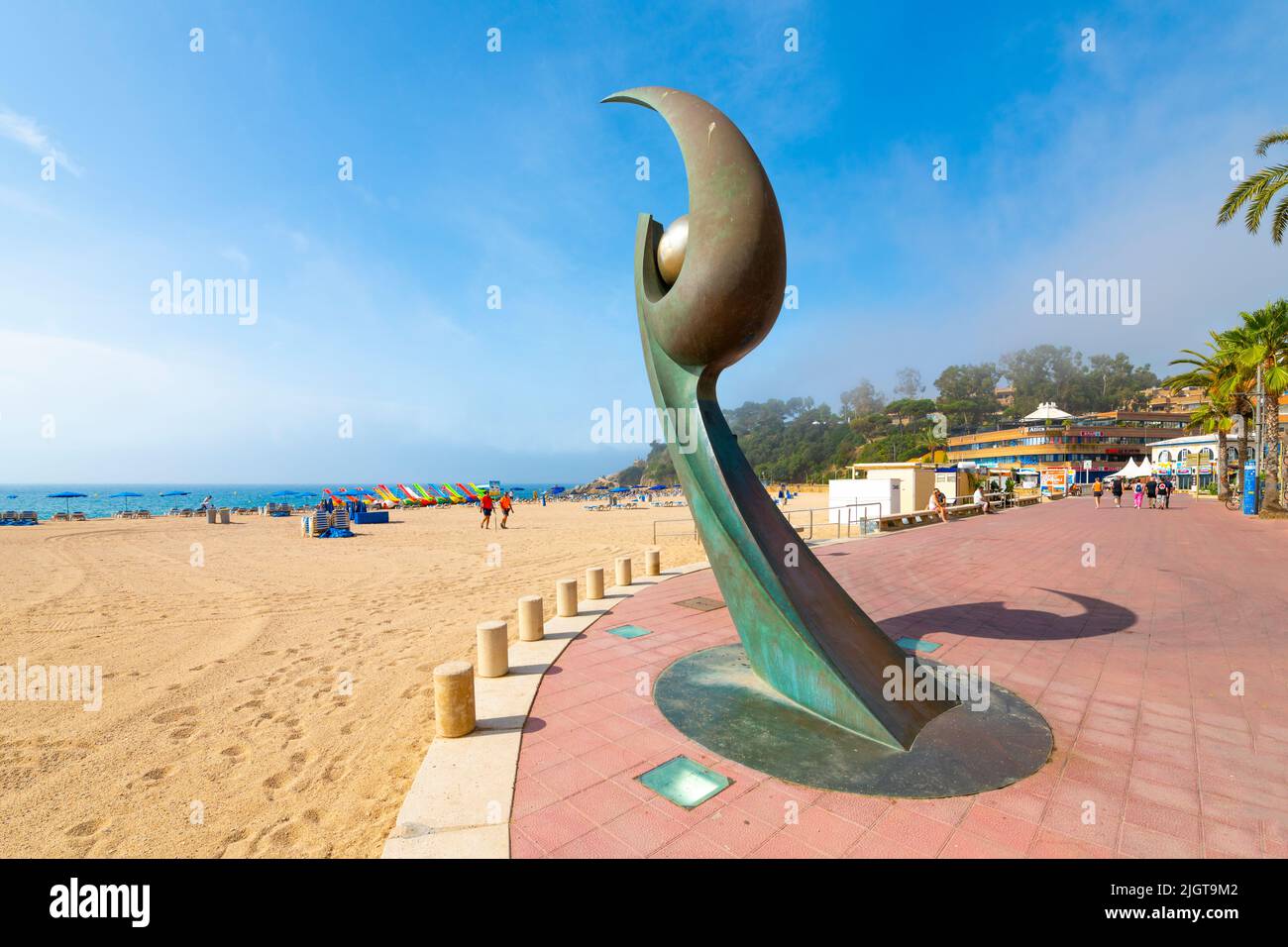 The metal, modern waterfront sculpture, Monument L'Esguard along the sandy beach at the resort town of Lloret de Mar, Spain, on the Costa Brava coast. Stock Photo