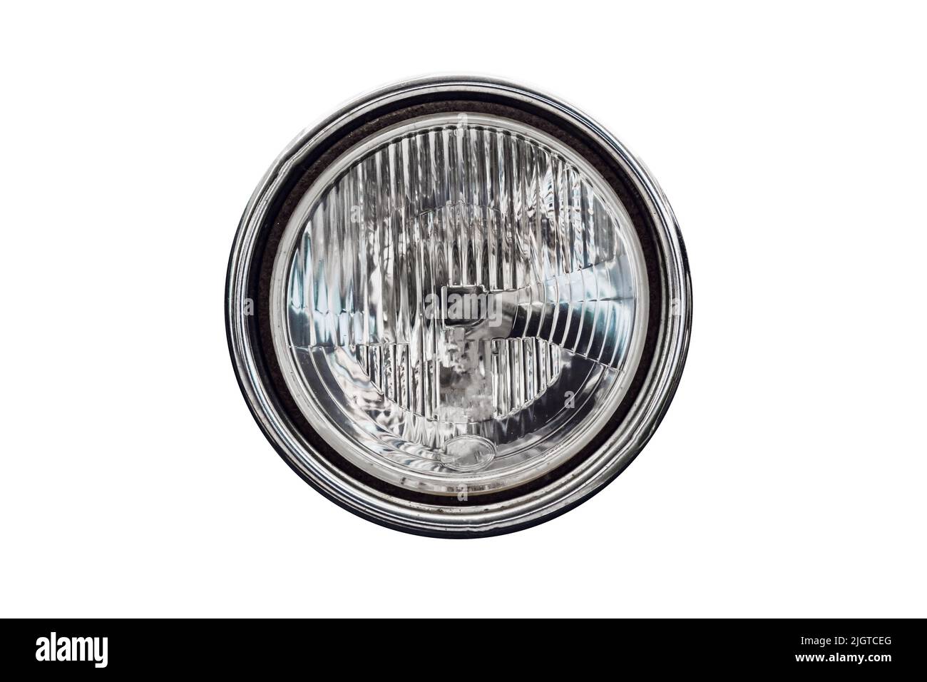 Old round headlight, an old-timer vehicle detail isolated on white background, close up Stock Photo