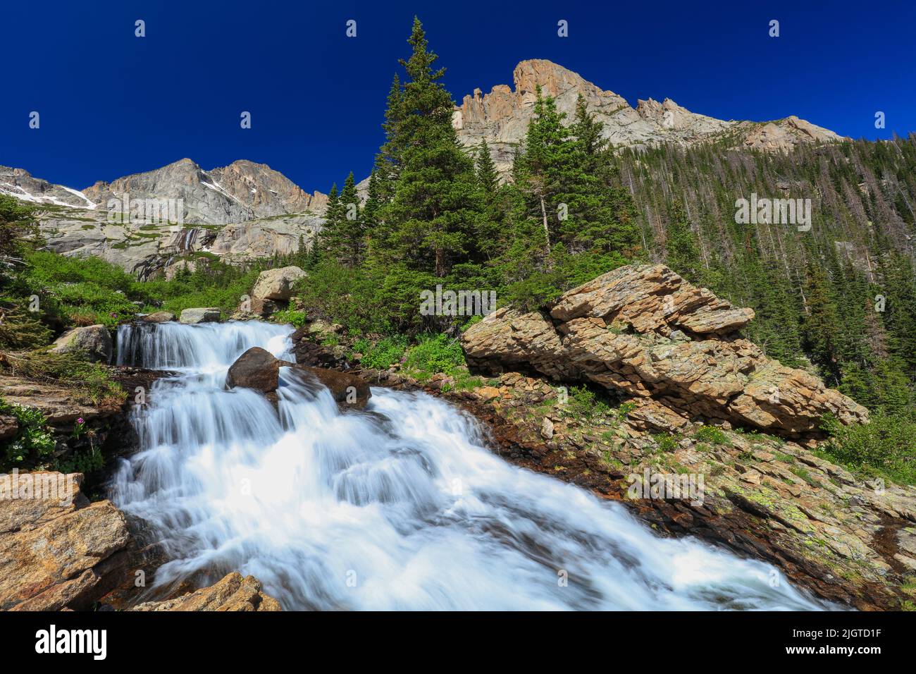 Ribbon Falls is a seasonal waterfall at the base of McHenry's Peak in Rocky Mountain National Park, Colorado Stock Photo