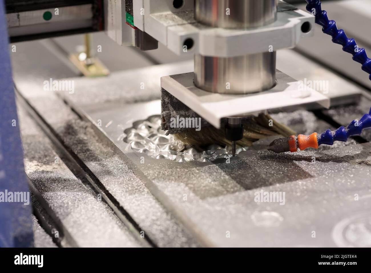 Die and mold making with CNC milling machine. Selective focus. Stock Photo