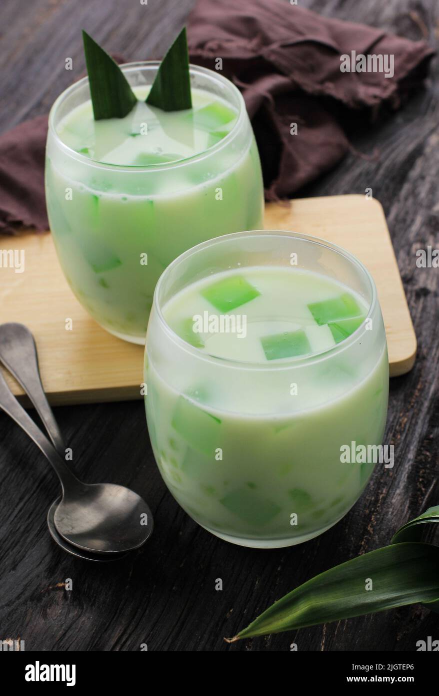 Buko Pandan,  Popular Dessert from Philippines, Made from Jelly, Young Coconut, Evaporated Milk, Sweetened Condensed Milk. On Wooden Table Stock Photo