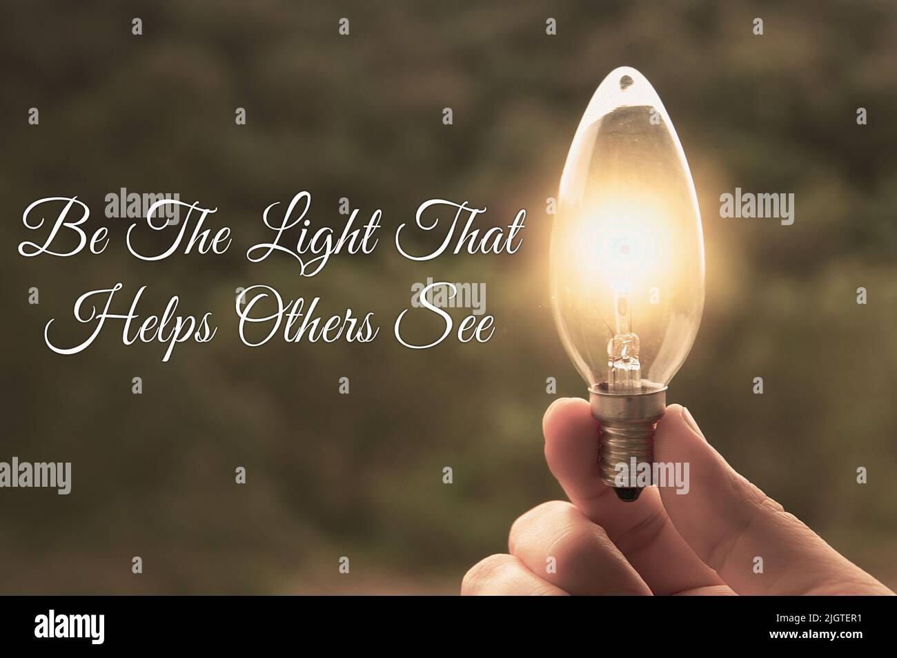 Motivational and Inspirational quote - Be the light that helps others see. With light bulb in vintage color background. Motivational concept Stock Photo
