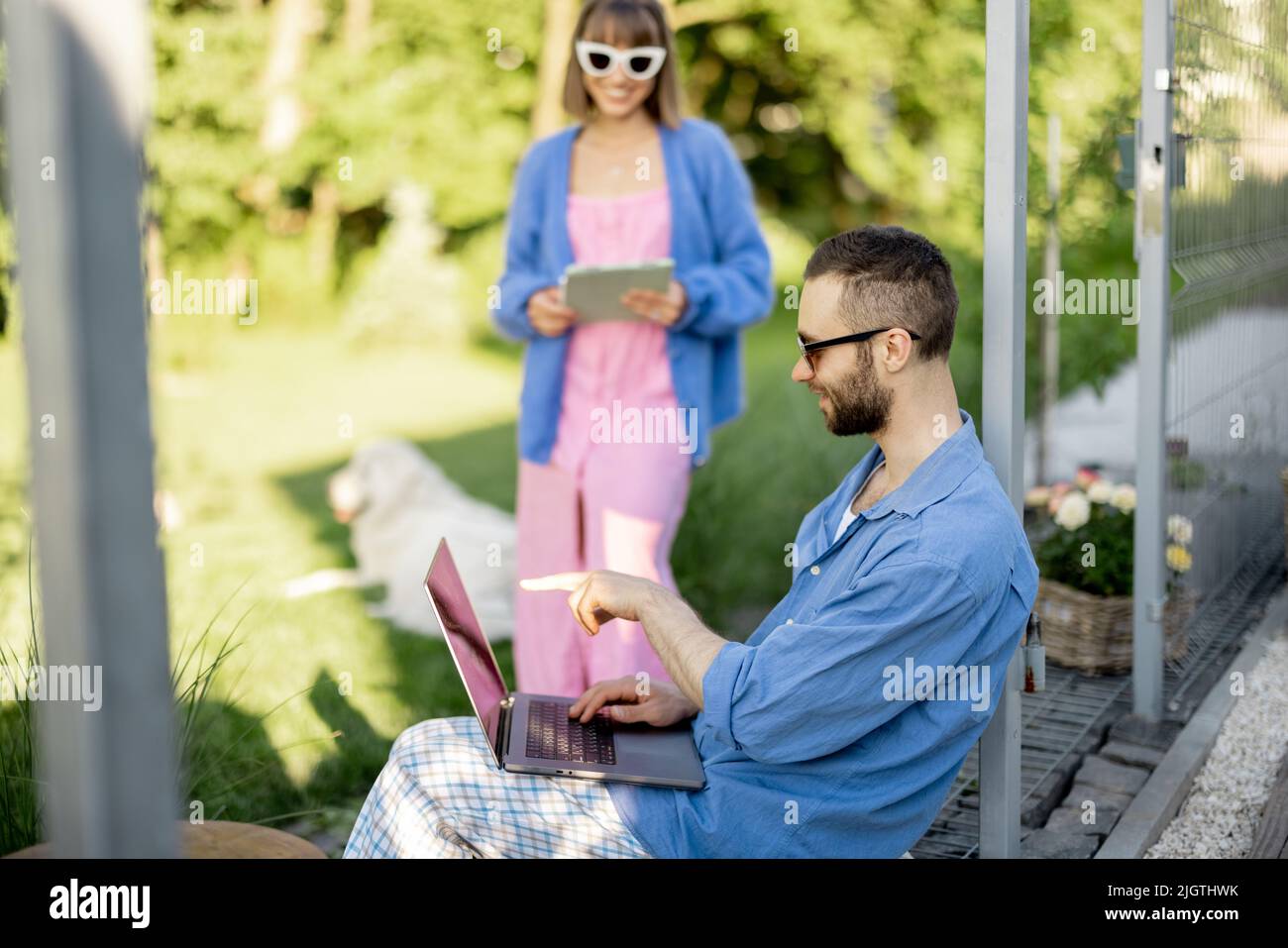 Couple work on laptop computer on nature Stock Photo