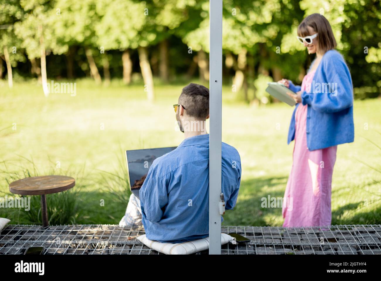Couple work on laptop computer on nature Stock Photo