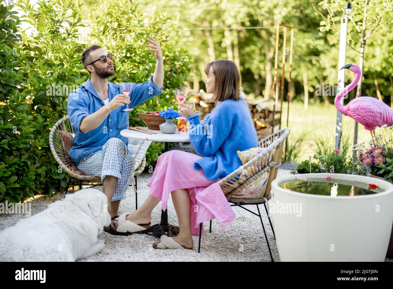 Stylish couple spend romantic evening at backyard Stock Photo