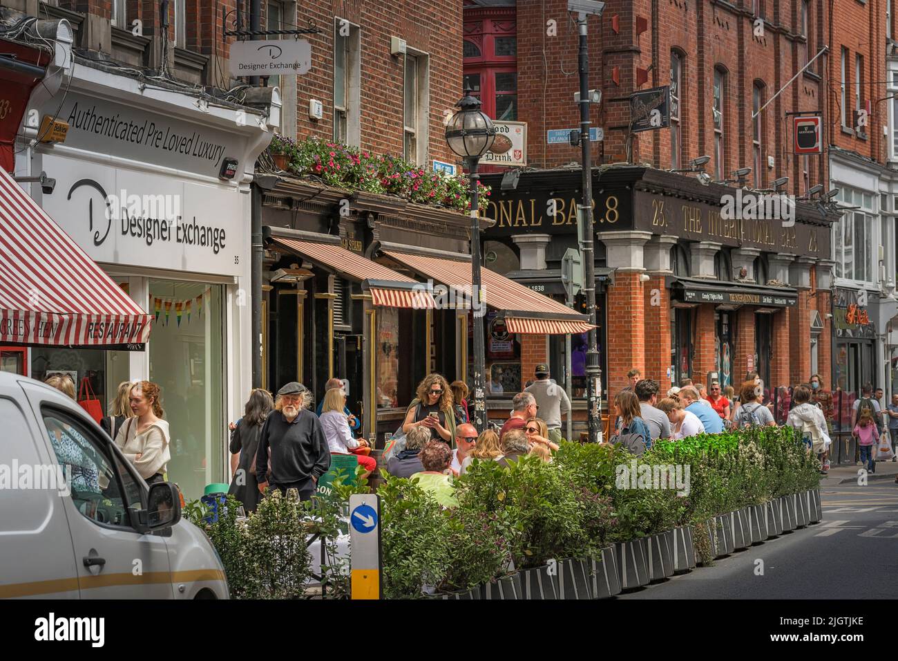 People dining outside The Old Stand pub, restaurant. Dublin. Ireland