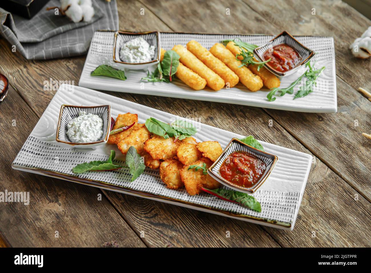 Portion of fried appetizers with sauces Stock Photo